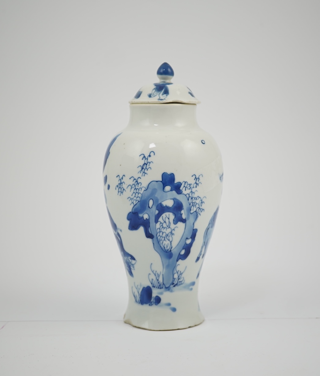 A Chinese blue and white baluster vase, early Kangxi, and associated cover